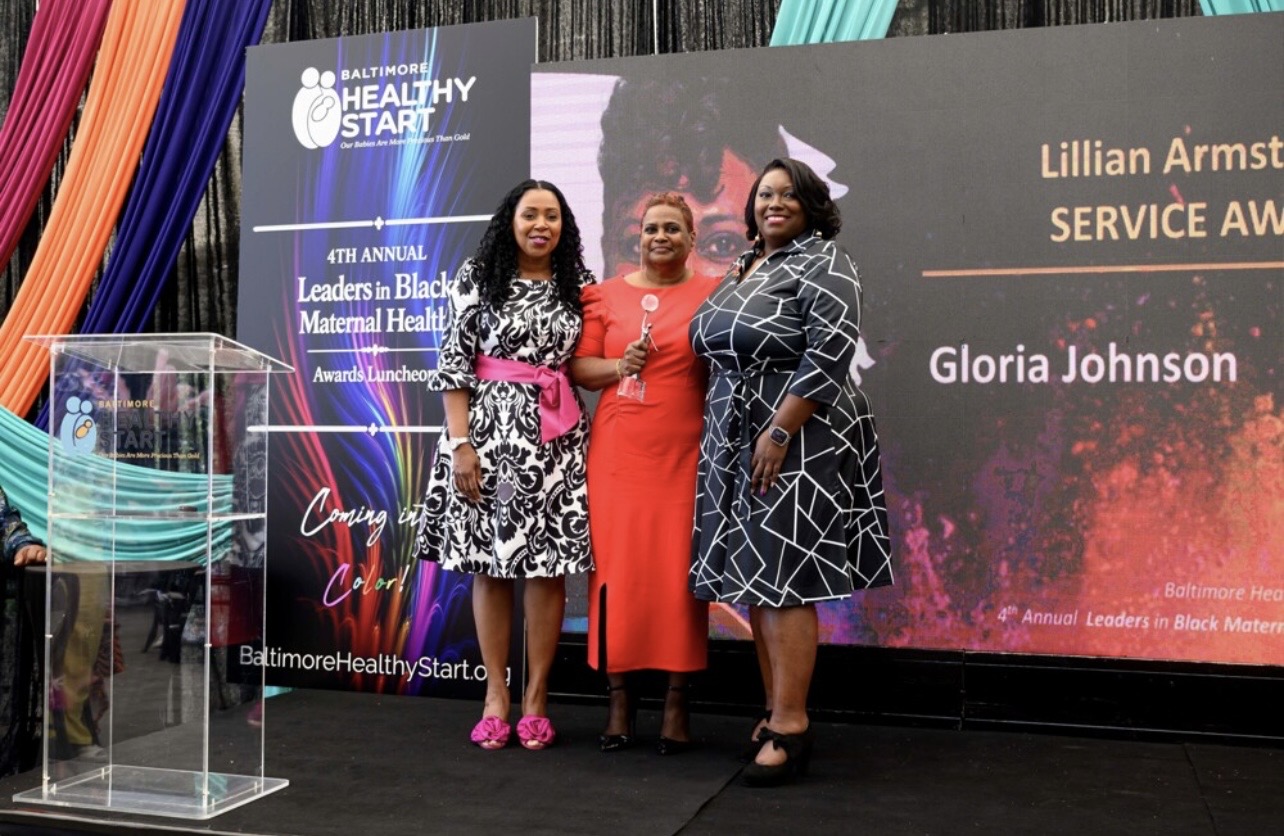 Gloria Johnson receiving award