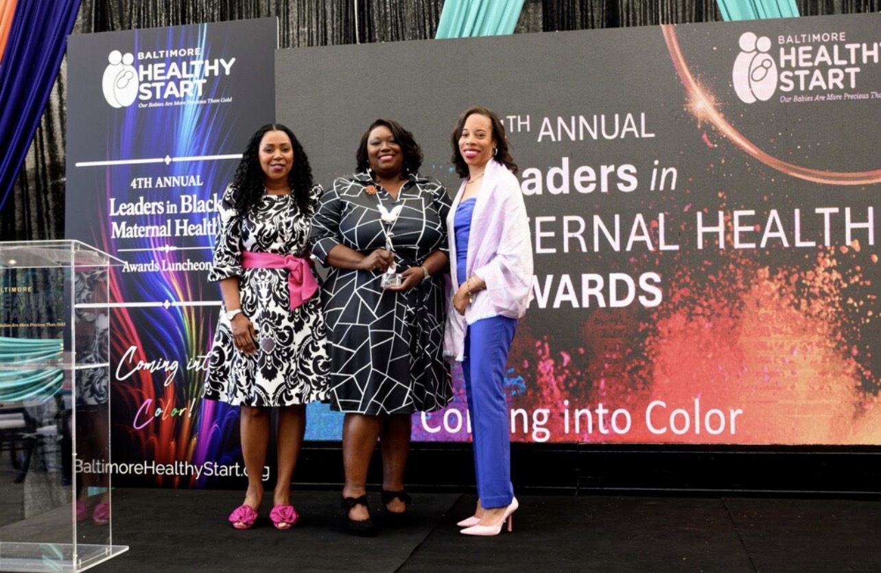 Terranina Hughes receiving award